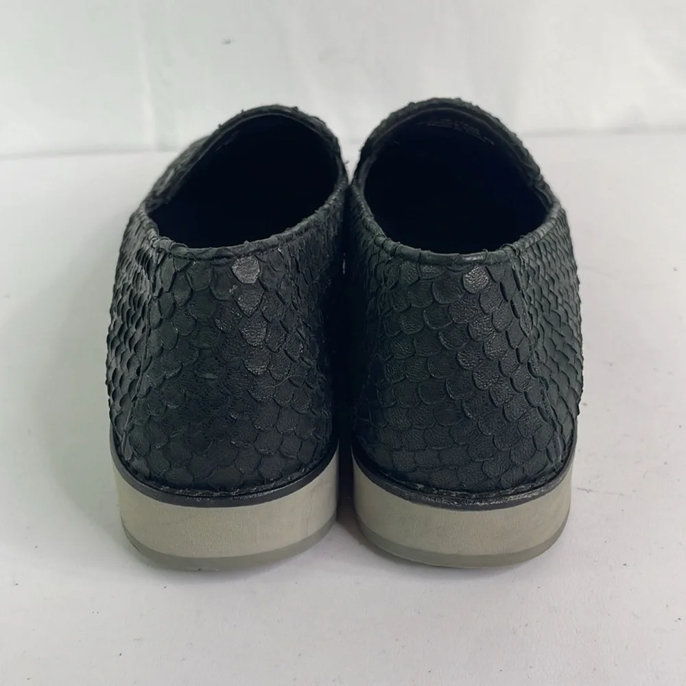 Johnston and Murphy, 781-1545. Texturized black leather loafers with gray soles.